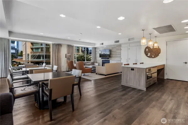 a projector room with furniture and a flat screen tv