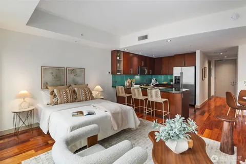 a kitchen with stainless steel appliances granite countertop a stove a refrigerator and a sink