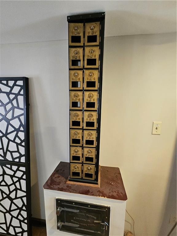 607 Middle Street Pittsburgh, PA 15212 - Photo 34 of 47 Vintage Post Office Box Bank?This image shows a tall, narrow antique post office box unit repurposed as a decorative piece or a bank.?Features