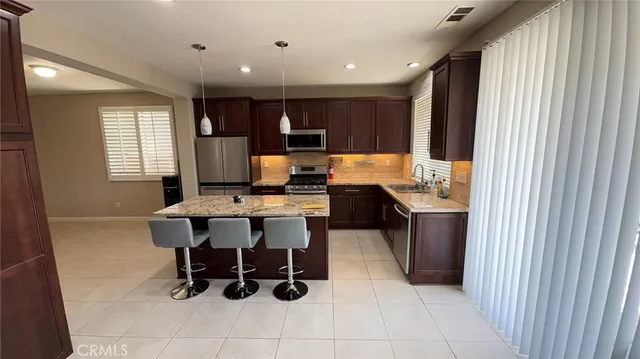 a kitchen with a table and chairs in it