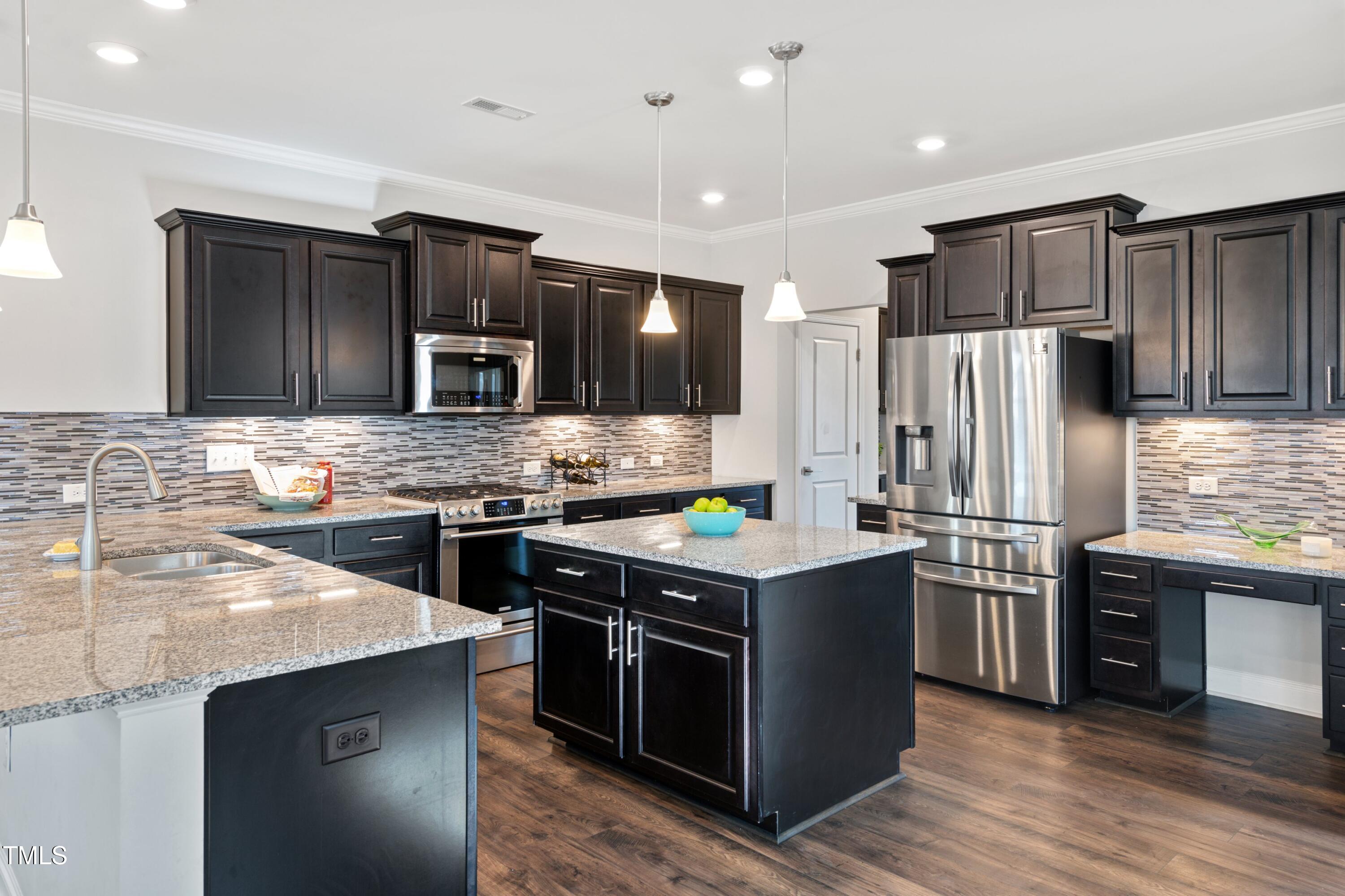 5501 Advancing Avenue Raleigh, NC 27616 - Photo 26 of 56 Kitchen island and long counter!