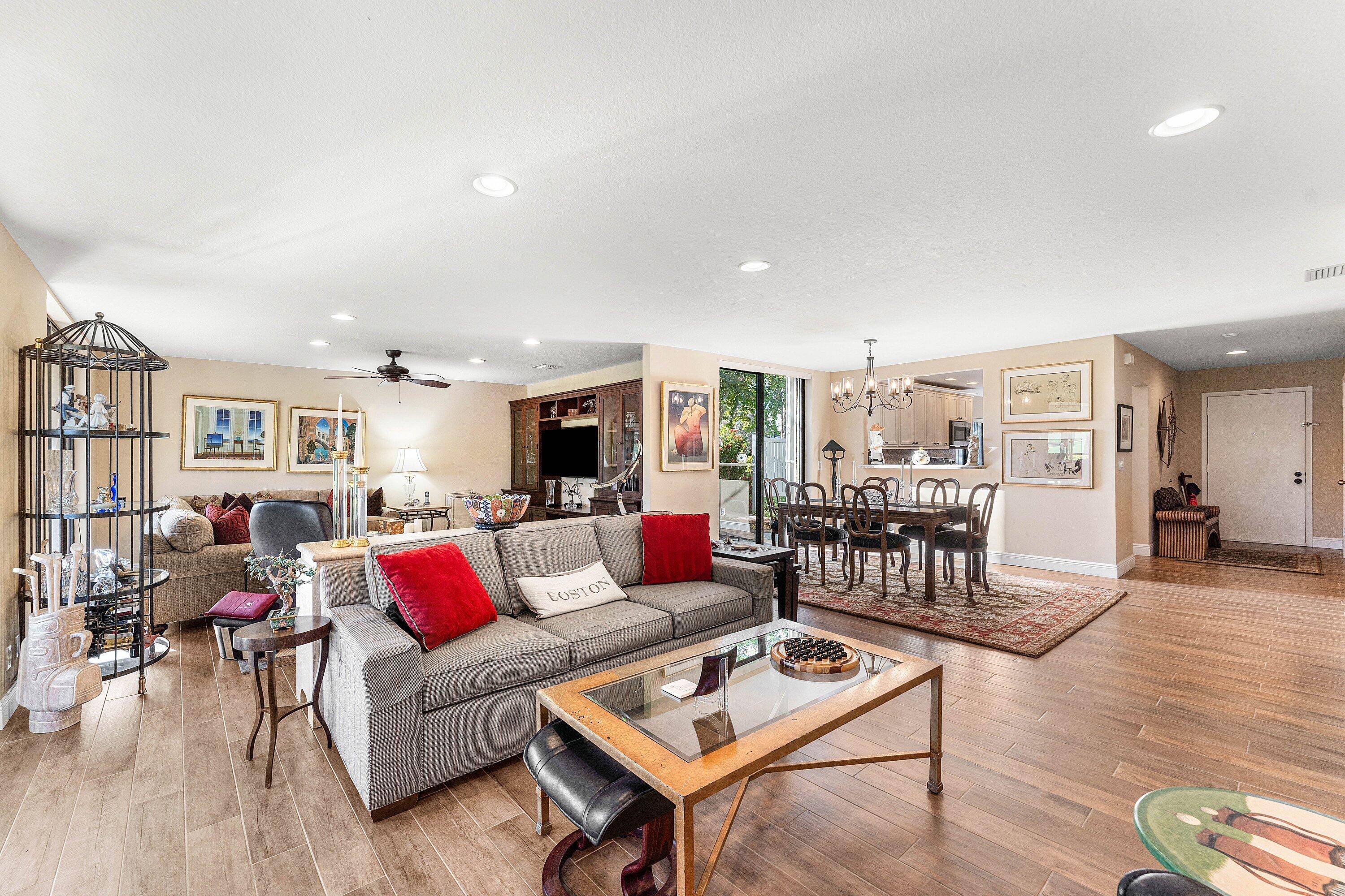 67 Eastgate Drive, Unit C Boynton Beach, FL 33436 - Photo 16 of 62 a living room with furniture and wooden floor