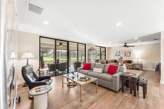 a kitchen with granite countertop white cabinets and stainless steel appliances