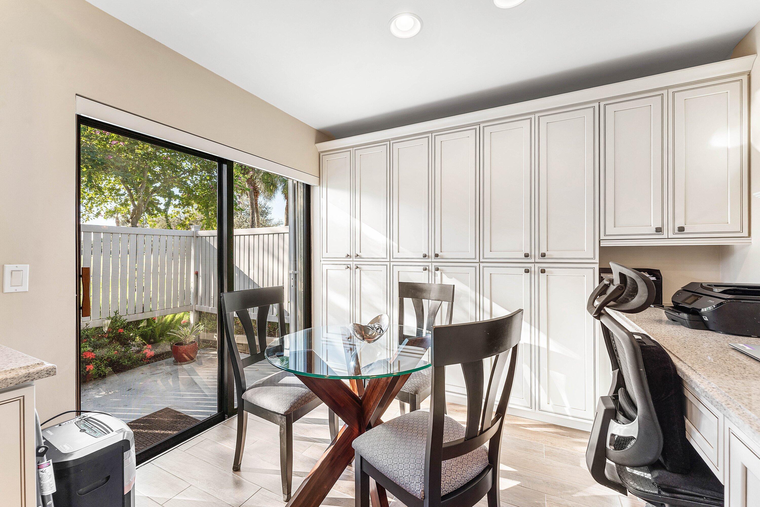 67 Eastgate Drive, Unit C Boynton Beach, FL 33436 - Photo 22 of 62 a dining room with furniture and a window