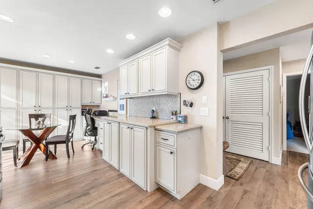a bedroom with two beds and a large window