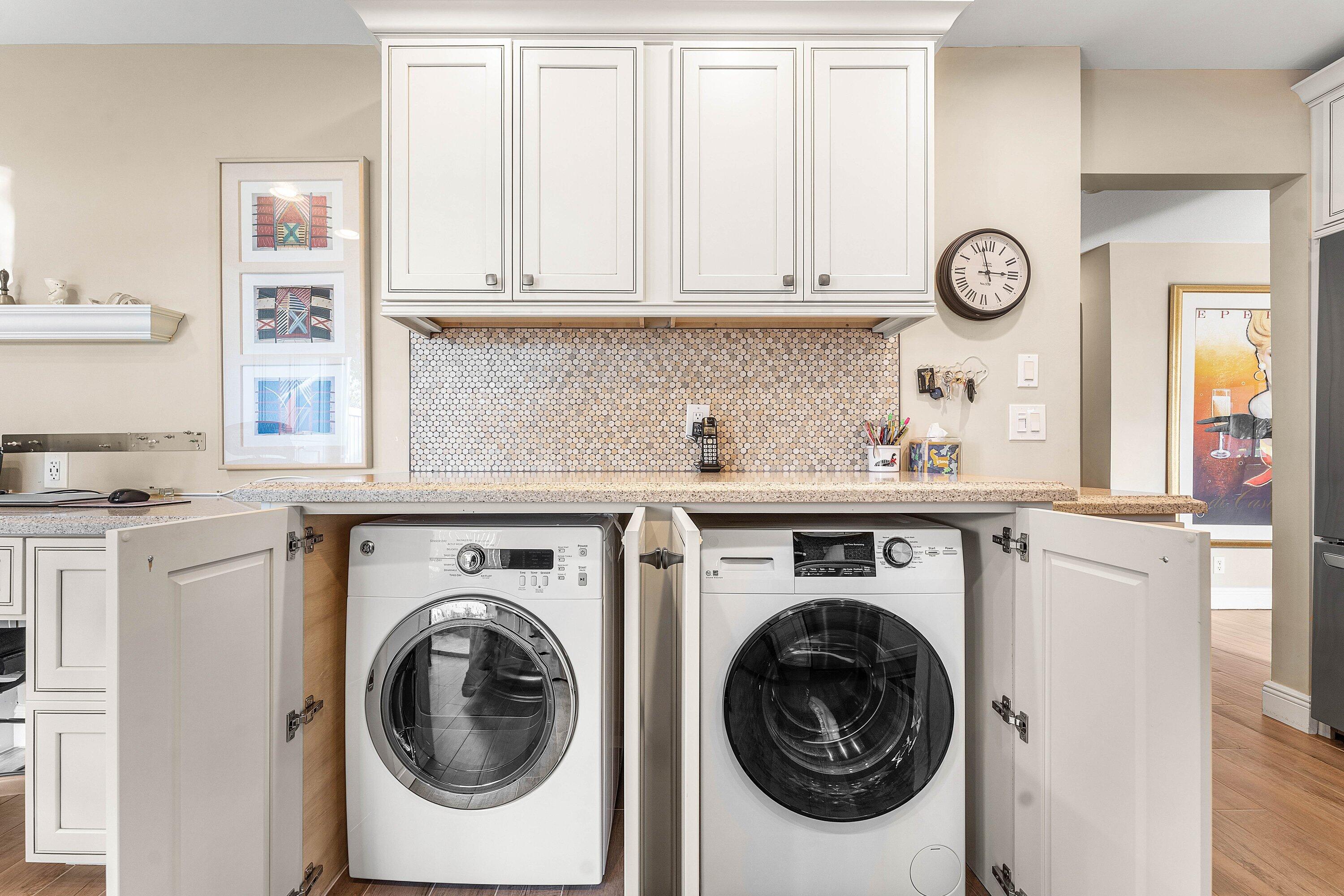 67 Eastgate Drive, Unit C Boynton Beach, FL 33436 - Photo 25 of 62 a utility room with dryer and washer