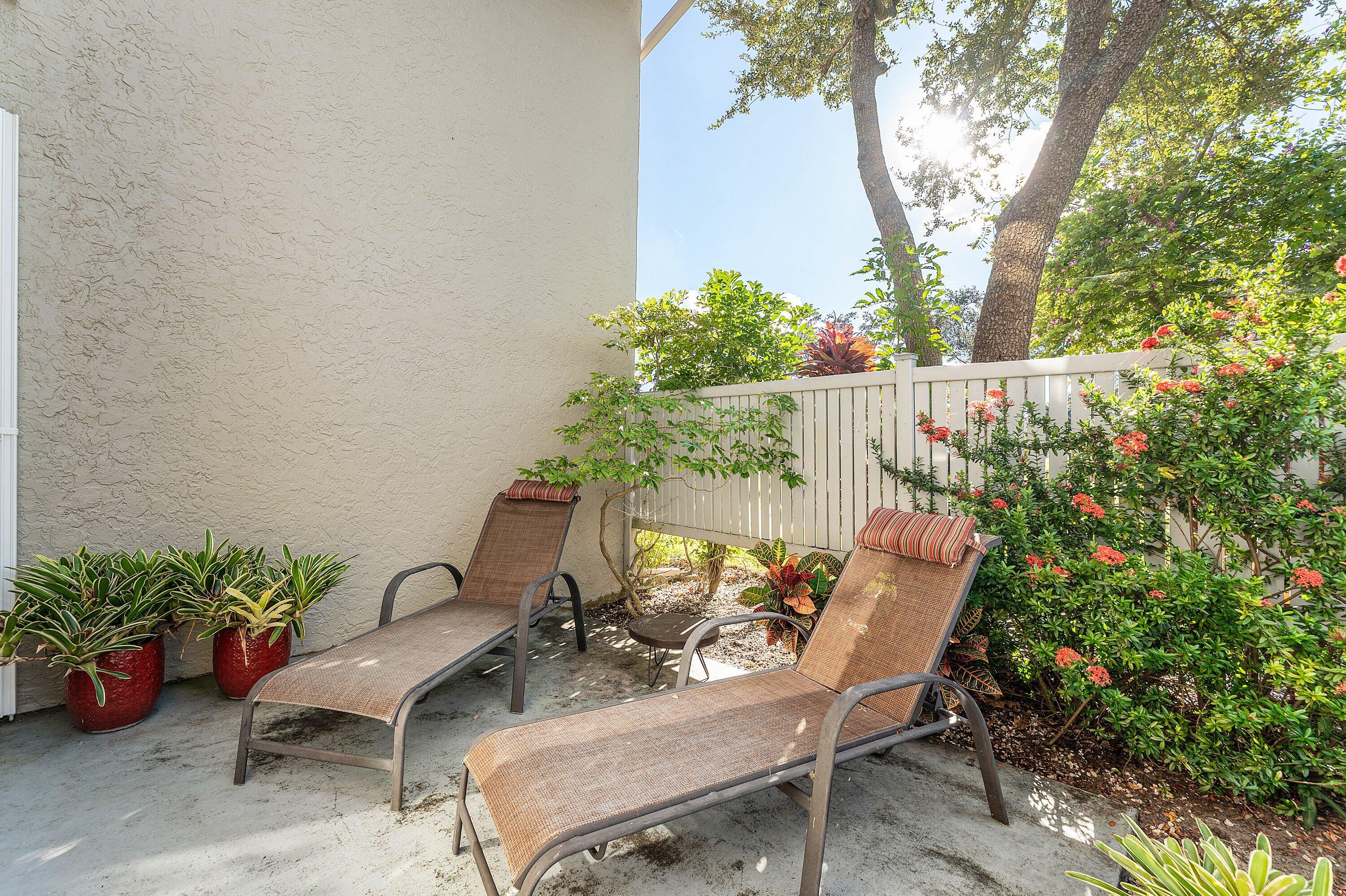 67 Eastgate Drive, Unit C Boynton Beach, FL 33436 - Photo 39 of 62 a view of a chair and table in backyard