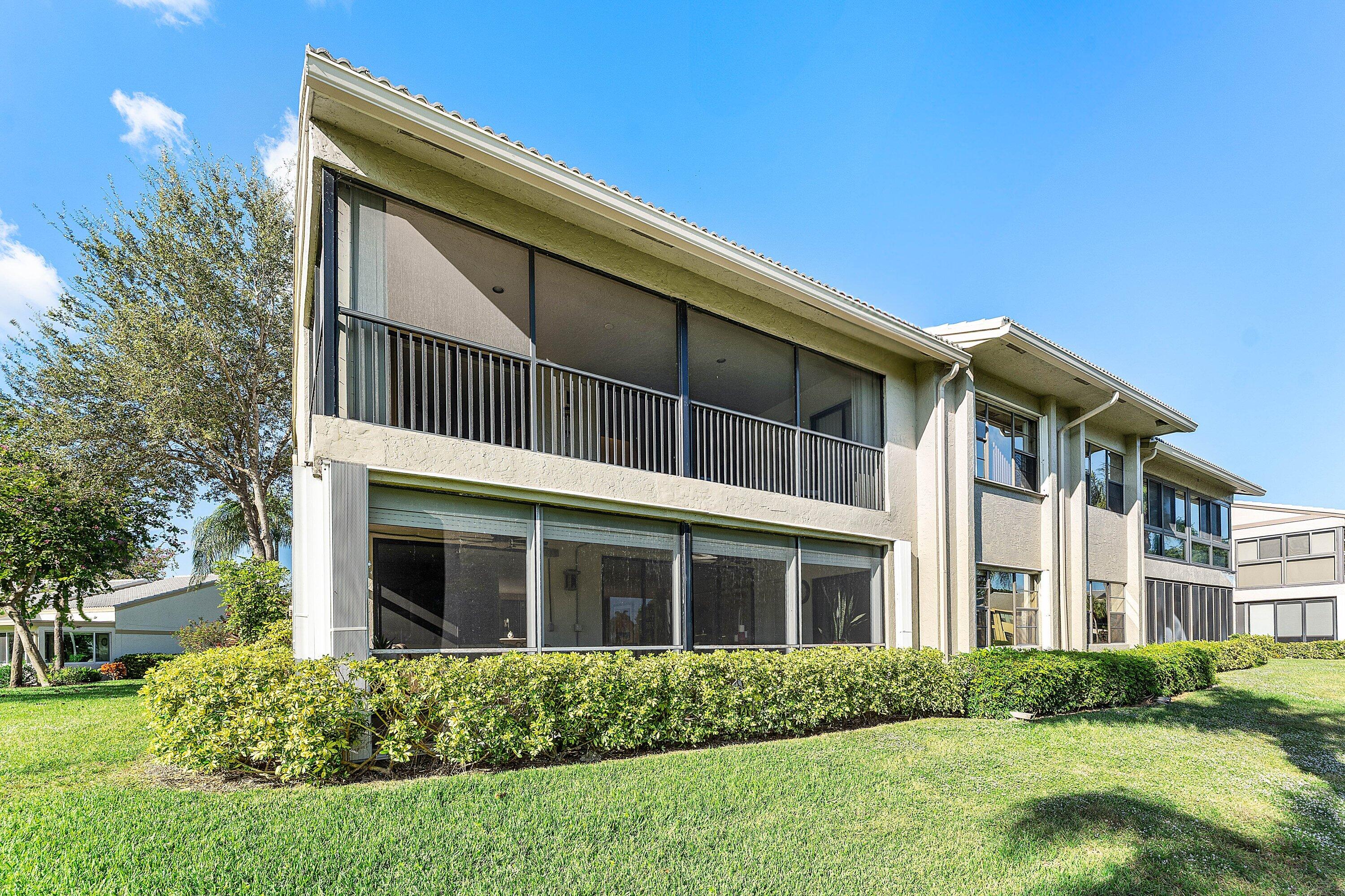 67 Eastgate Drive, Unit C Boynton Beach, FL 33436 - Photo 42 of 62 a front view of a house with a yard