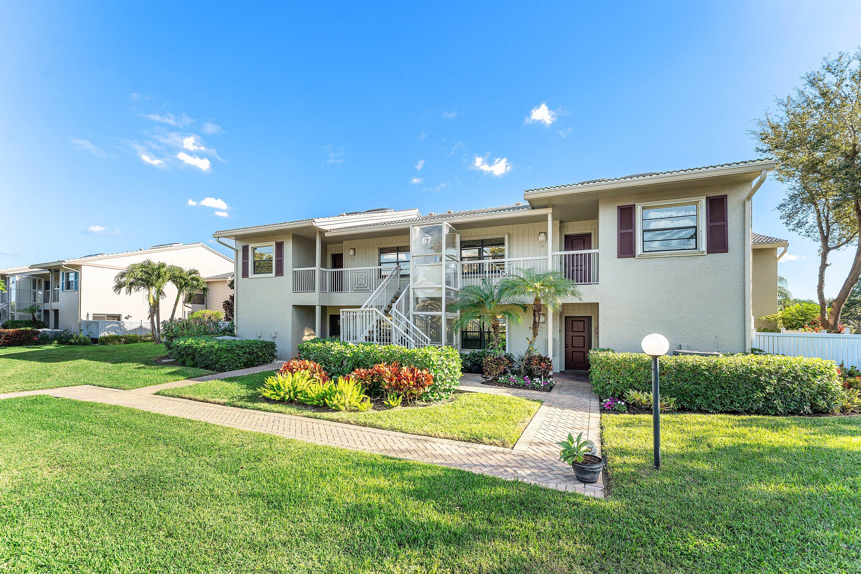 67 Eastgate Drive, Unit C Boynton Beach, FL 33436 - Photo 5 of 62 a front view of house with yard