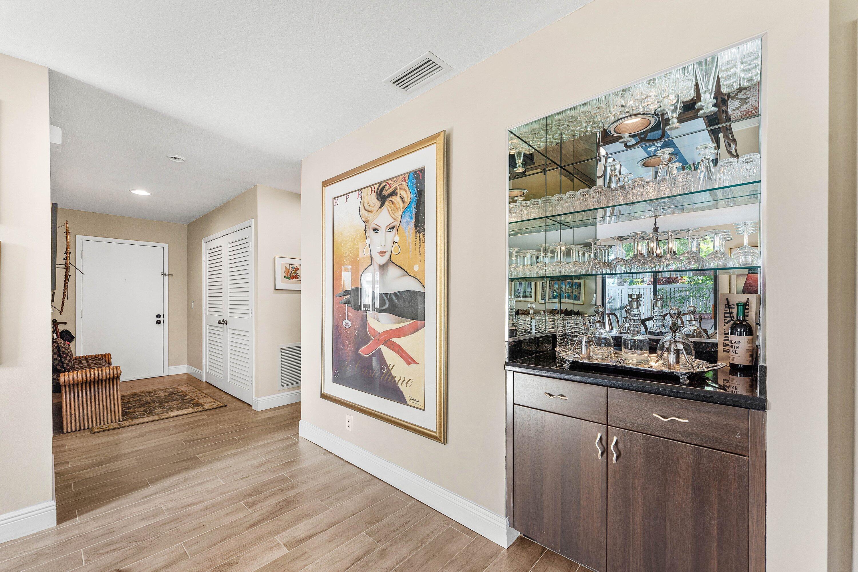 67 Eastgate Drive, Unit C Boynton Beach, FL 33436 - Photo 8 of 62 a view of a room with wooden floor and windows