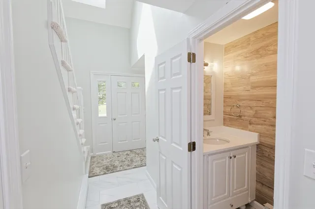 a bathroom with a shower and a sink