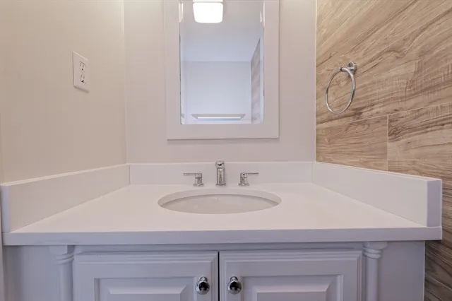 a bathroom with a sink and a mirror