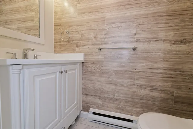 a bathroom with a toilet and a sink