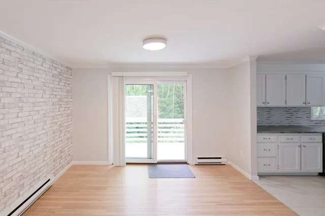 a view of a kitchen with a sink and dishwasher wooden floor