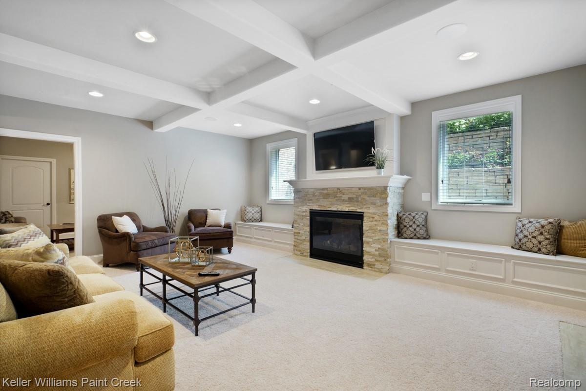 2777 South Addison Circle Rochester, MI 48306 - Photo 74 of 85 Built in window seats surround the stone fireplace.