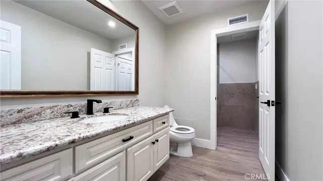 a bathroom with a mirror and a shower