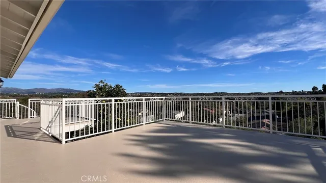 a view of balcony with two chairs