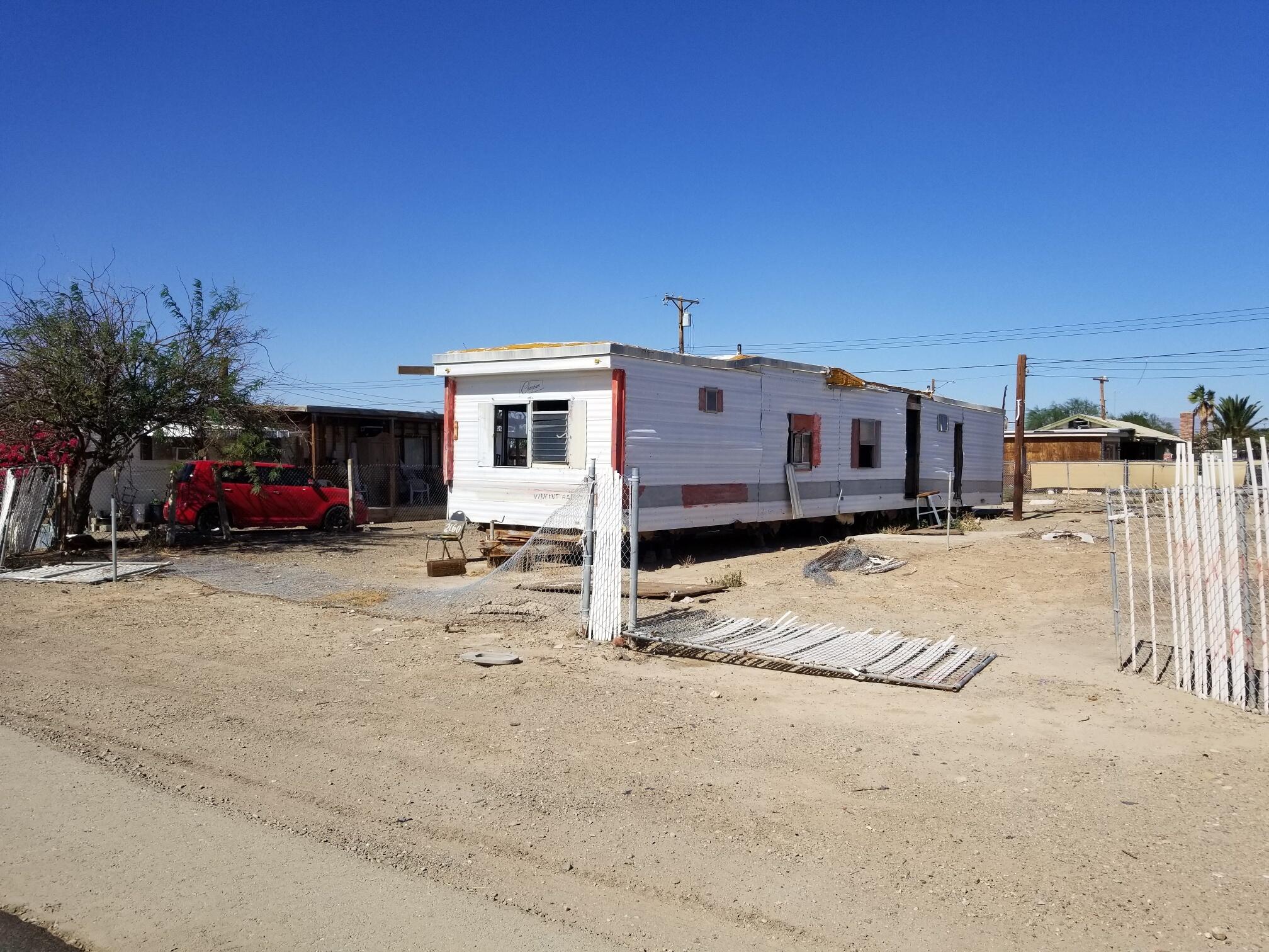 2160 3rd Street Bombay Beach, CA 92257 - Photo 4 of 5 a view of a car park in front of a house