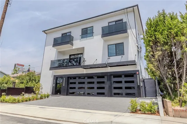 a view of front door and potted plants