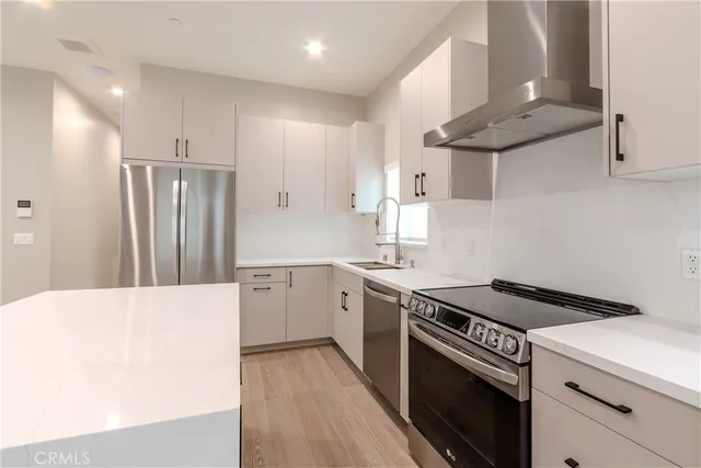 a bathroom with double sink and a mirror