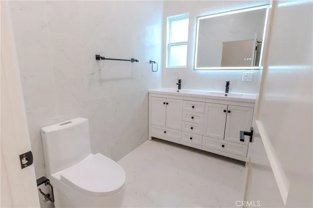 a bathroom with a shower and a glass door