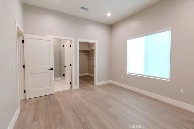 a bathroom with a sink toilet and a mirror