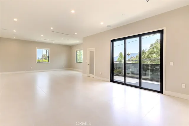 a kitchen with stainless steel appliances a stove a refrigerator and a sink