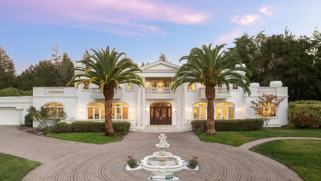 a view of a house with outdoor space and street view