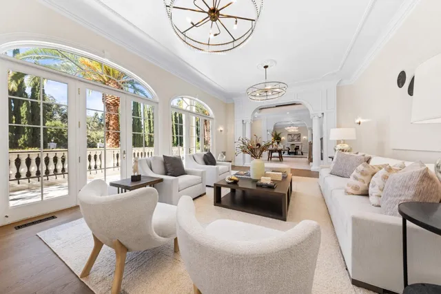 a living room with furniture a fireplace and decor