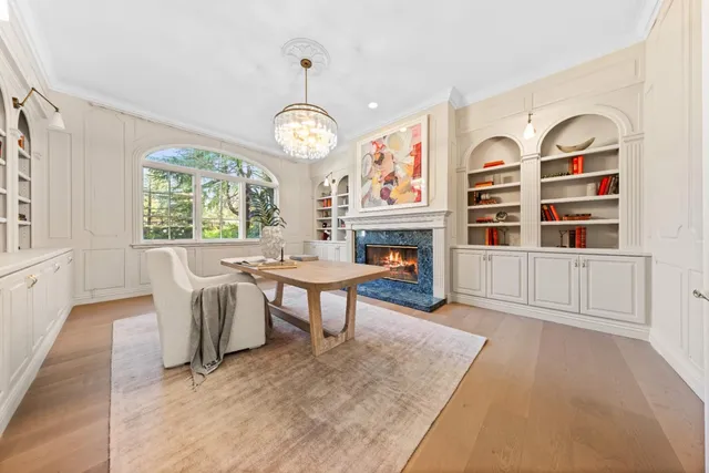 a kitchen with granite countertop white cabinets and sink