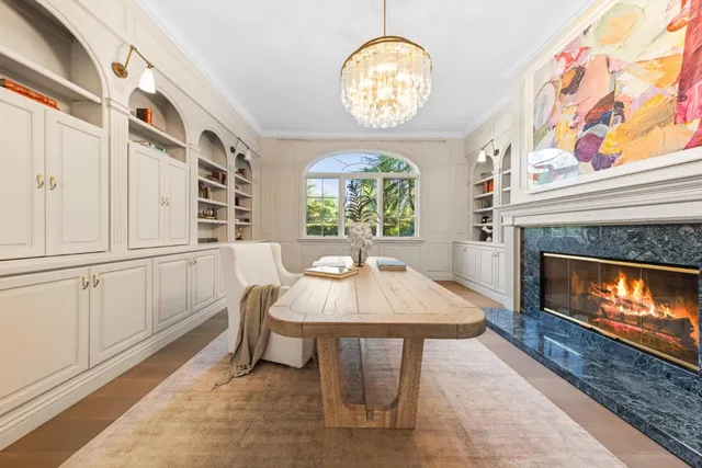 a kitchen with stainless steel appliances kitchen island granite countertop a stove and a sink