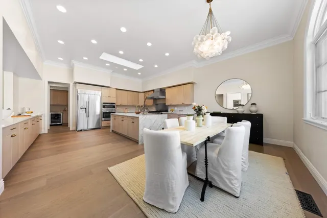a living room with furniture a rug and white walls