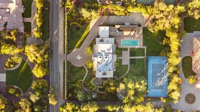 a living room with furniture or chandelier and a mirror