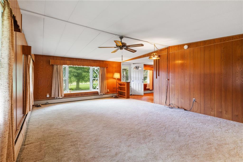 57 North Hope Mill Road Mercer, PA 16137 - Photo 11 of 49 an empty room with windows and ceiling fan