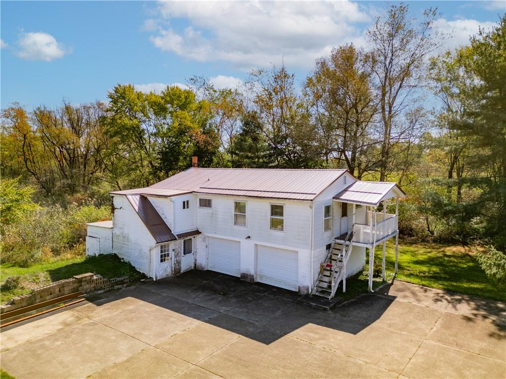 57 North Hope Mill Road Mercer, PA 16137 - Photo 3 of 49 an aerial view of a house with a yard and large trees