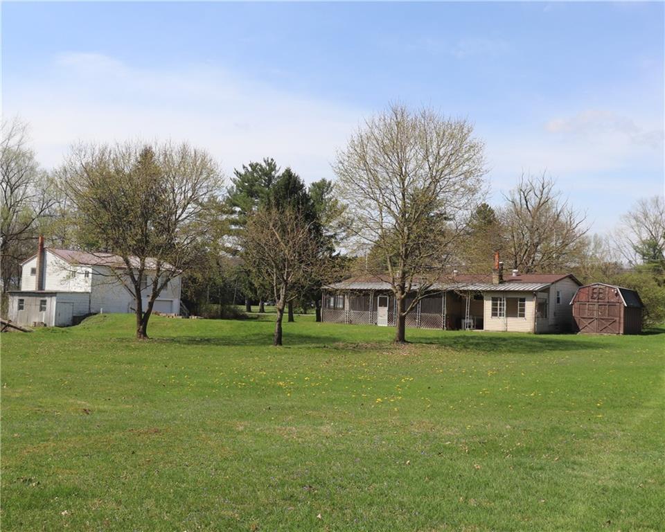 57 North Hope Mill Road Mercer, PA 16137 - Photo 31 of 49 a front view of a house with a yard and trees
