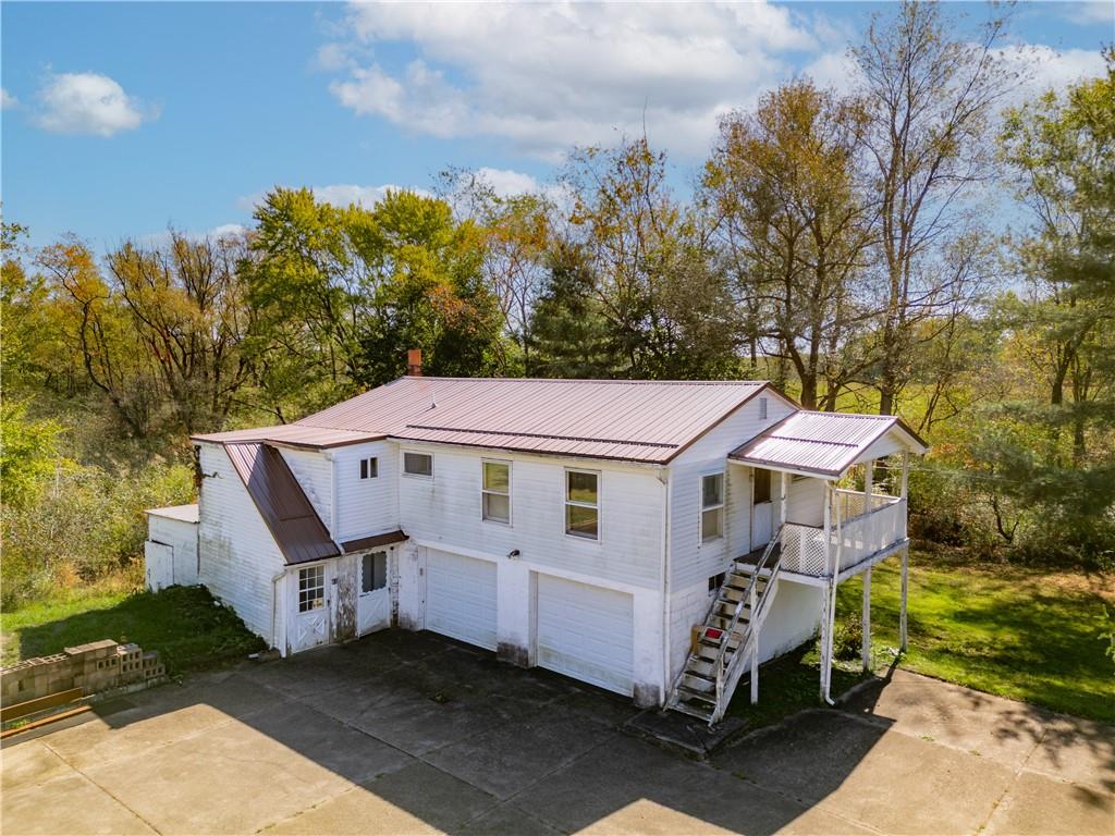 57 North Hope Mill Road Mercer, PA 16137 - Photo 32 of 49 a front view of a house with garden