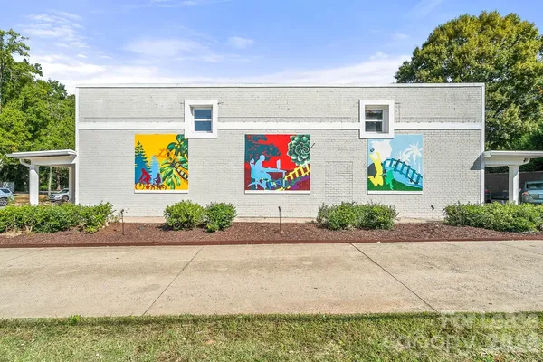 a front view of house with a garden and entryway