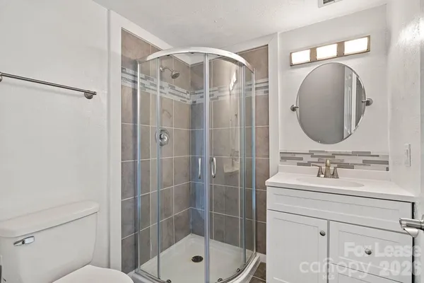 a bathroom with a sink double vanity and a mirror