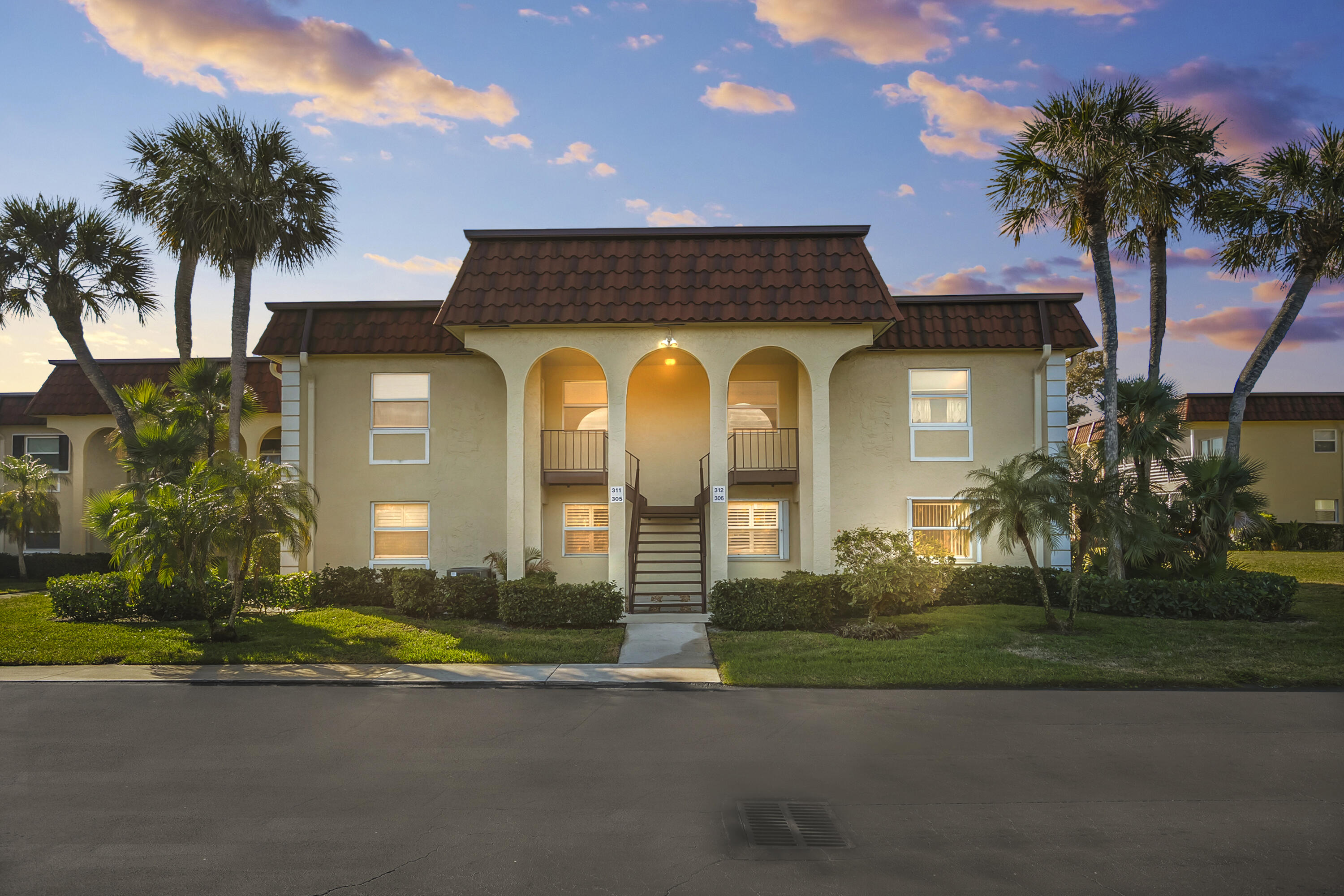 717 Highway 1, Unit 305 Jupiter, FL 33477 - Photo 1 of 51 a front view of a house with a garden