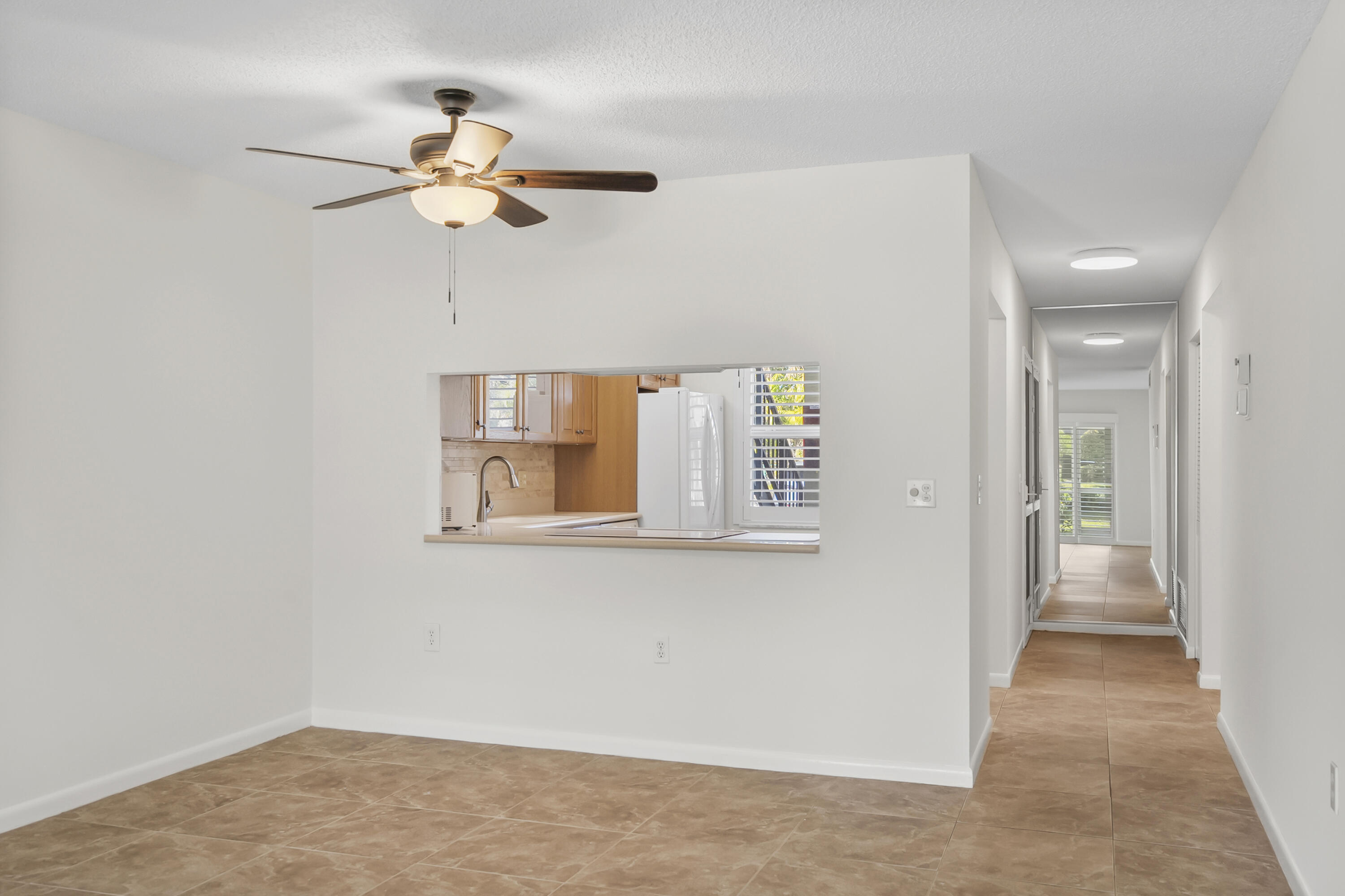 717 Highway 1, Unit 305 Jupiter, FL 33477 - Photo 19 of 51 a view of a livingroom with a chandelier fan