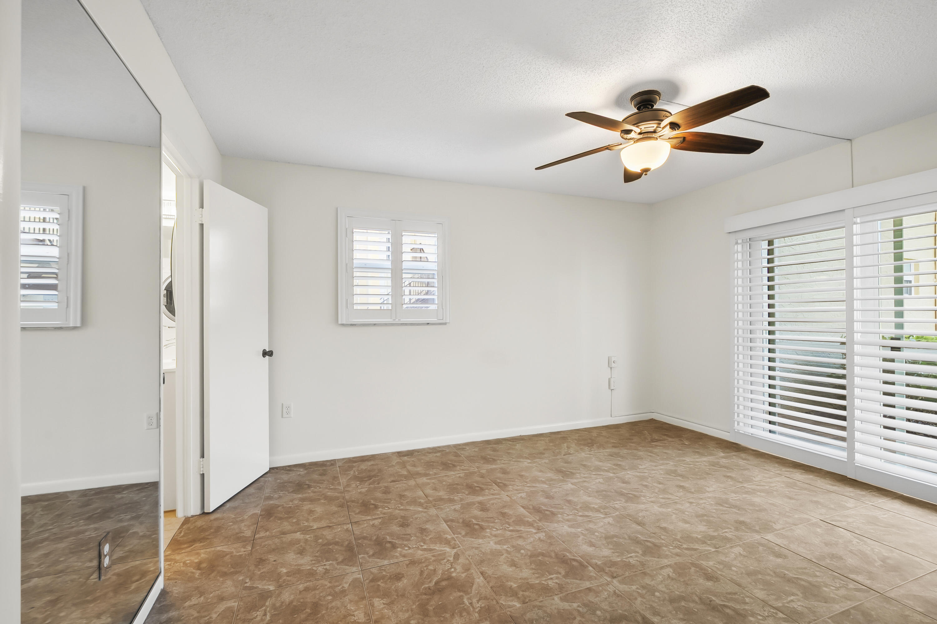 717 Highway 1, Unit 305 Jupiter, FL 33477 - Photo 23 of 51 a view of an empty room with a window