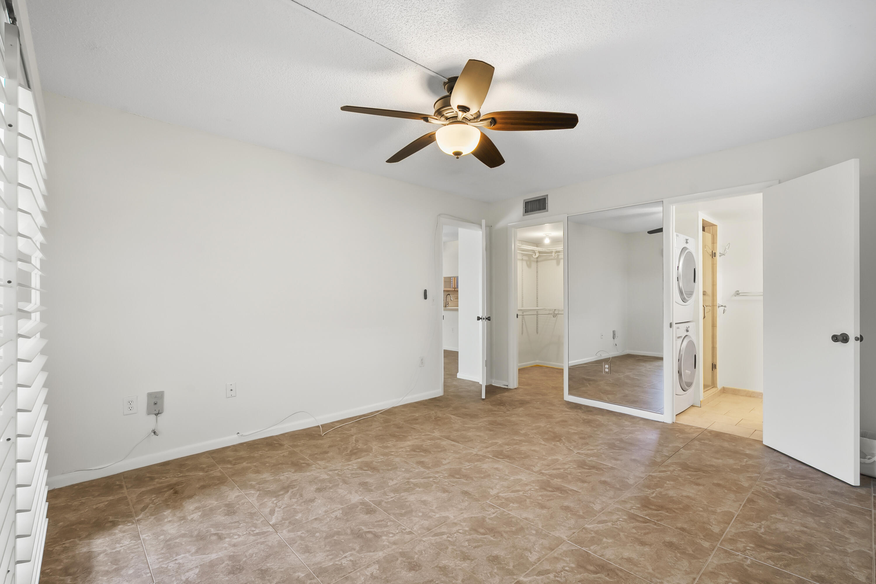 717 Highway 1, Unit 305 Jupiter, FL 33477 - Photo 24 of 51 a view of empty room with window and ceiling fan