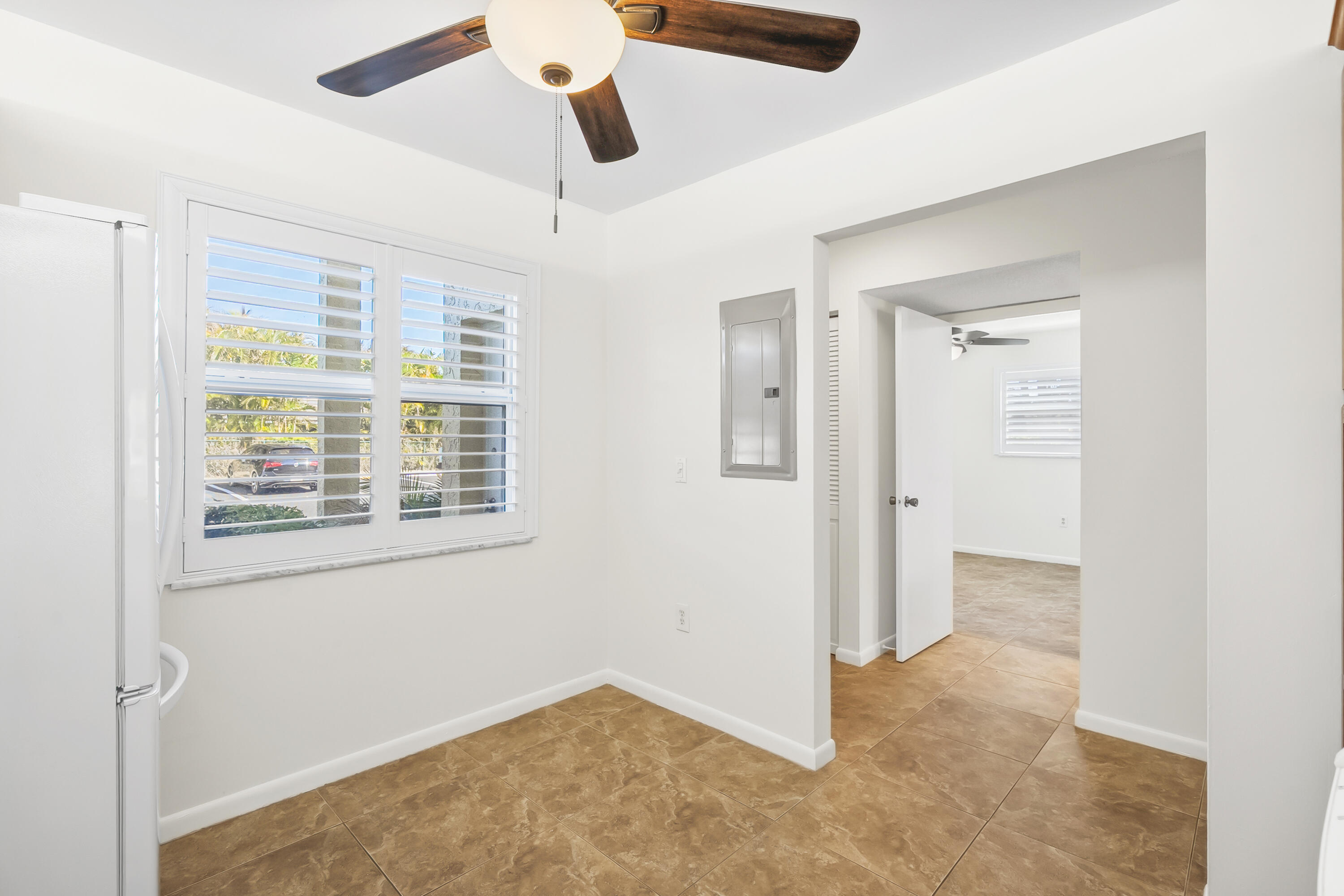 717 Highway 1, Unit 305 Jupiter, FL 33477 - Photo 28 of 51 a view of an empty room with a window