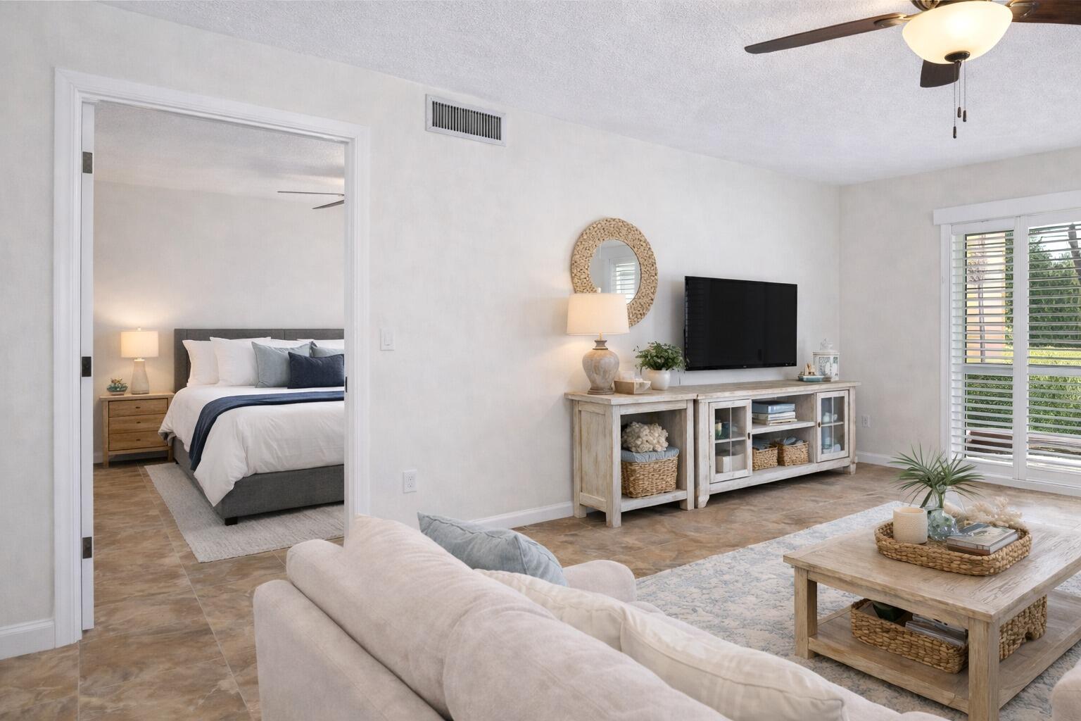 717 Highway 1, Unit 305 Jupiter, FL 33477 - Photo 5 of 51 a bedroom with furniture and a flat screen tv