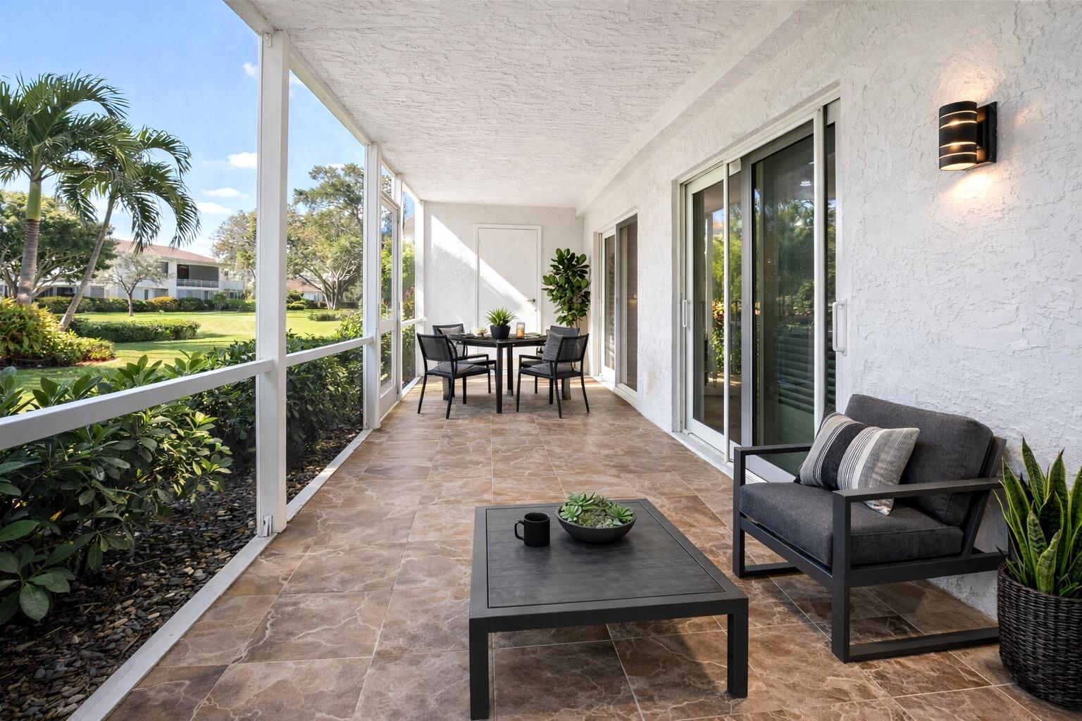 717 Highway 1, Unit 305 Jupiter, FL 33477 - Photo 9 of 51 a dining room with furniture and a floor to ceiling window