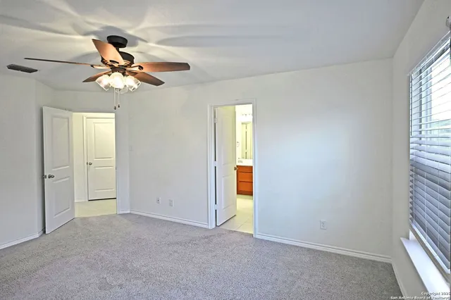 a bathroom with a tub a sink and mirror