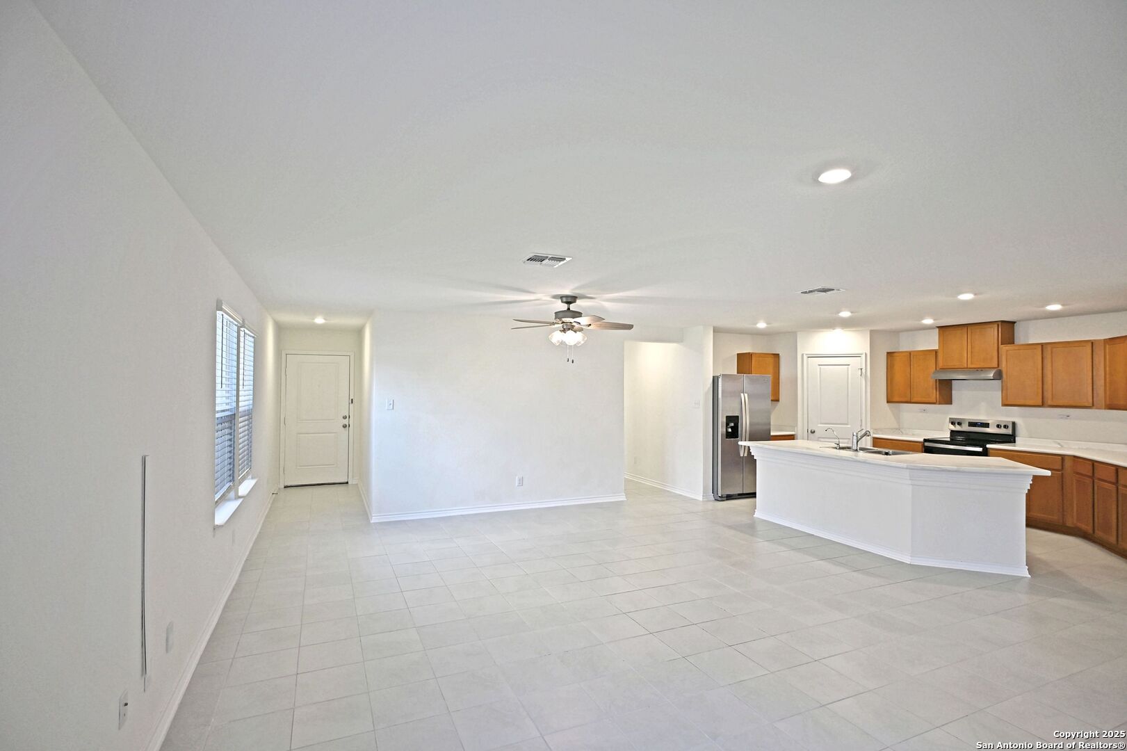 512 Dakota Creek New Braunfels, TX 78130 - Photo 5 of 38 a view of a kitchen with a sink and a stove top oven