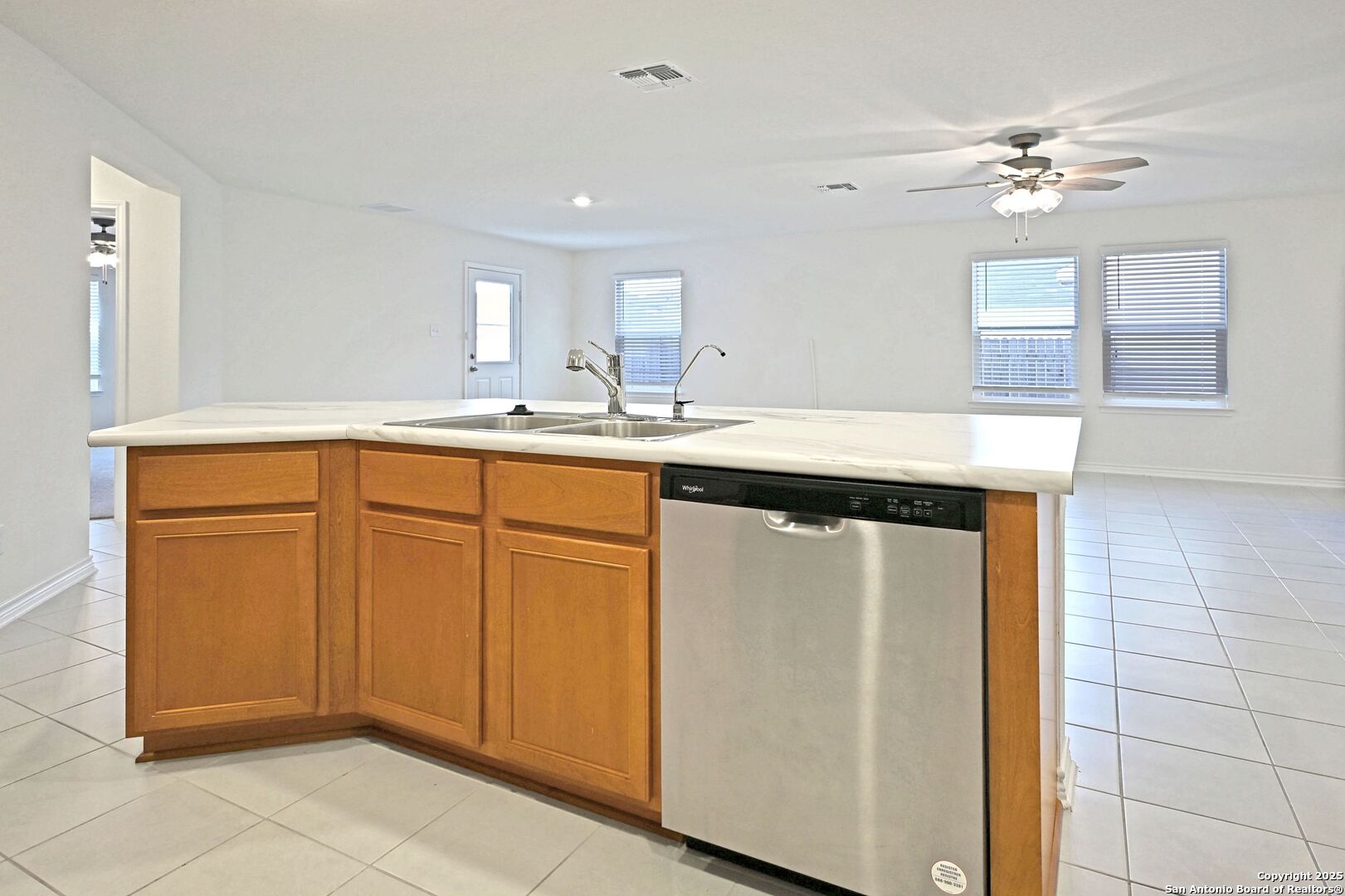 512 Dakota Creek New Braunfels, TX 78130 - Photo 9 of 38 a kitchen with cabinets and chandelier
