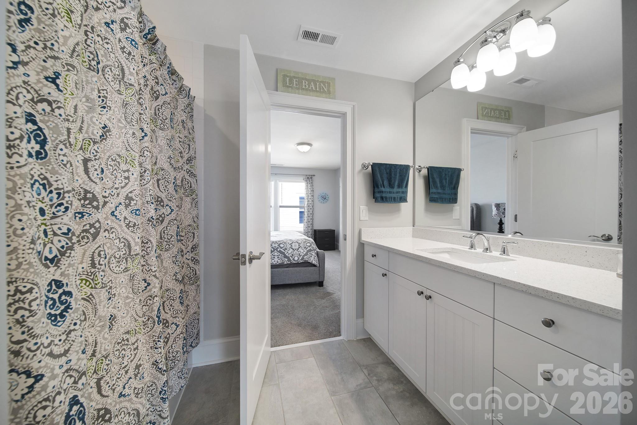 1633 Half Pint Loop Fort Mill, SC 29708 - Photo 23 of 48 a spacious bathroom with a double vanity sink mirror and shower